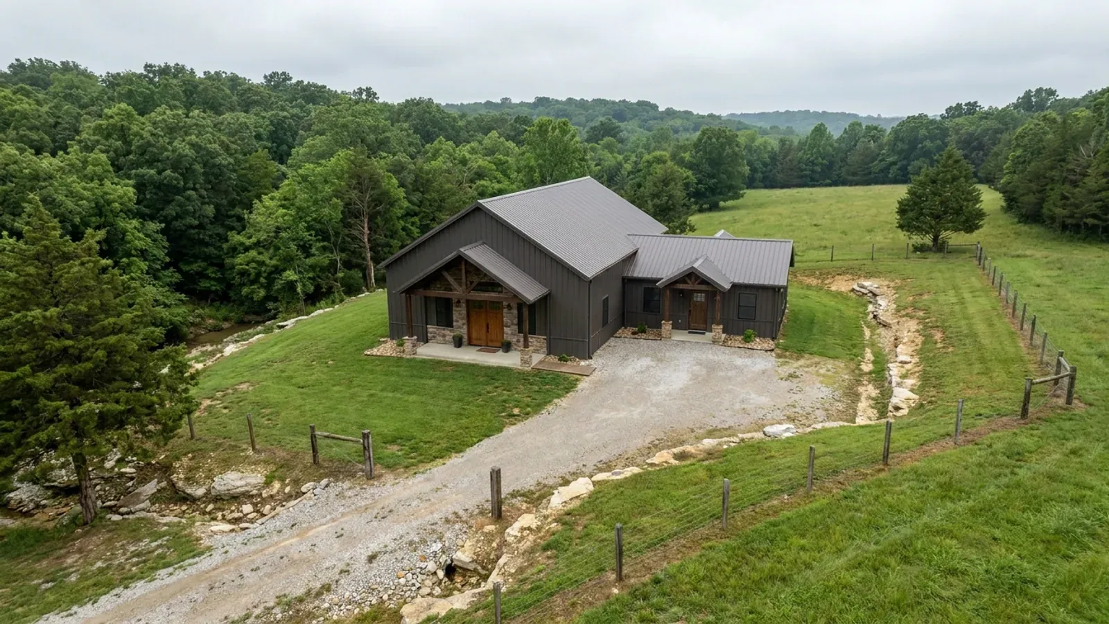 A barndominium with a smaller attached in-law suite wing that has its own separate covered entry, distinct from the main entry.